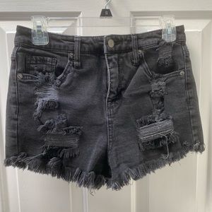 Distressed black cutoff denim